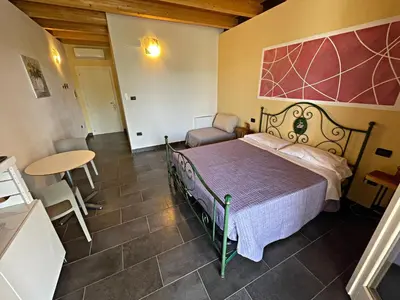 Letto o letti in una camera di Agriturismo scannaporco