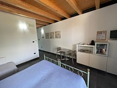 Letto o letti in una camera di Agriturismo scannaporco