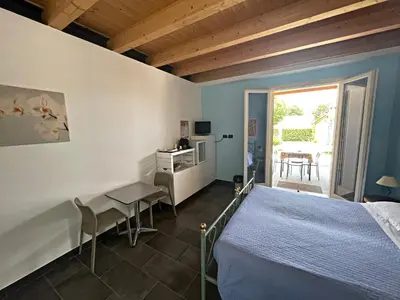 Letto o letti in una camera di Agriturismo scannaporco