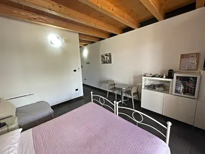 Letto o letti in una camera di Agriturismo scannaporco