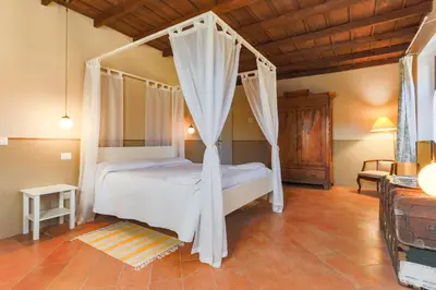 Letto o letti in una camera di AGRITURISMO LE CORTI DELLA GUALDANA