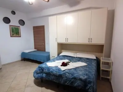 Letto o letti in una camera di Villa Glori affitto camere monolocali