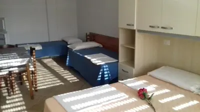 Letto o letti in una camera di Villa Glori affitto camere monolocali