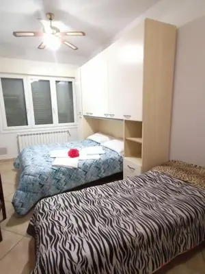 Letto o letti in una camera di Villa Glori affitto camere monolocali