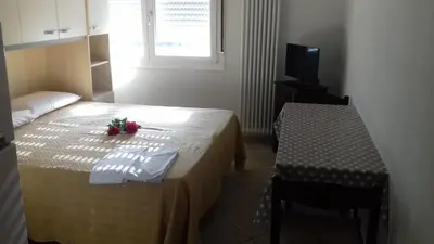 Letto o letti in una camera di Villa Glori affitto camere monolocali