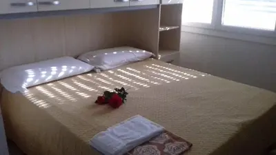Letto o letti in una camera di Villa Glori affitto camere monolocali