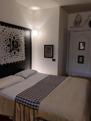 Letto o letti in una camera di Il cortiletto
