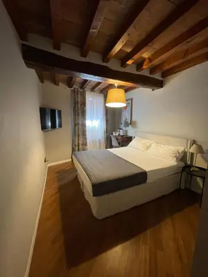 Letto o letti in una camera di Le Camere di Bsuites Affittacamere