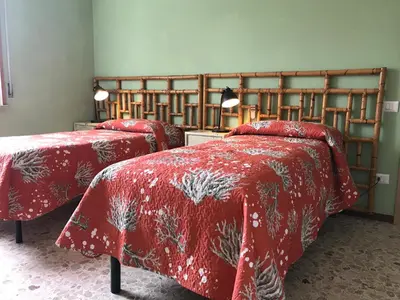 Letto o letti in una camera di B&B Ospedale Maggiore Parma affittacamere