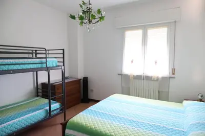 Letto o letti in una camera di B&B L'uva Fragolina