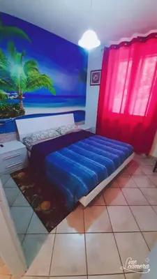 Letto o letti in una camera di Casa Maria