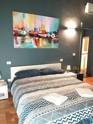 Letto o letti in una camera di Modena Charme Sant'Eufemia