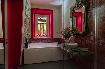 Letto o letti in una camera di Relais SANT'AMBROGIO