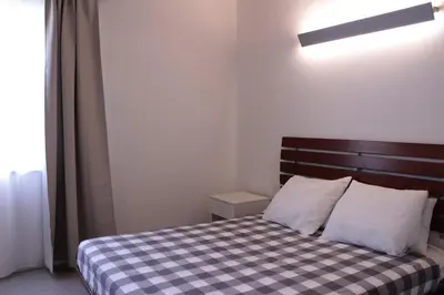 Letto o letti in una camera di Agriturismo Bacchanalis
