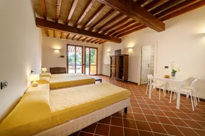 Letto o letti in una camera di La Corte del Mulino