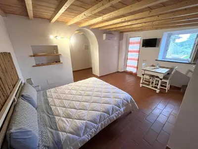 Letto o letti in una camera di B&B Alla Fortezza