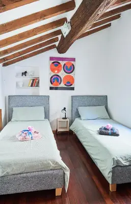 Letto o letti in una camera di La Casa di Giulia-Family Apartment