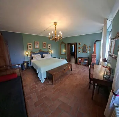 Letto o letti in una camera di B&B Podere Merlo