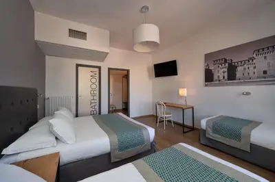 Letto o letti in una camera di Hotel dei Gonzaga, MantegnaHotels