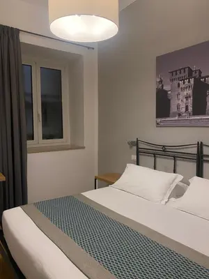 Letto o letti in una camera di Hotel dei Gonzaga, MantegnaHotels