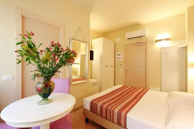 Letto o letti in una camera di Hotel Souvenir