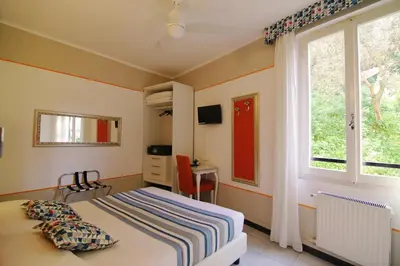 Letto o letti in una camera di Hotel Souvenir
