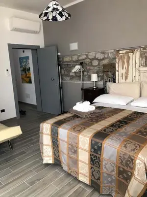 Letto o letti in una camera di Alla Porta Di Sotto B&B