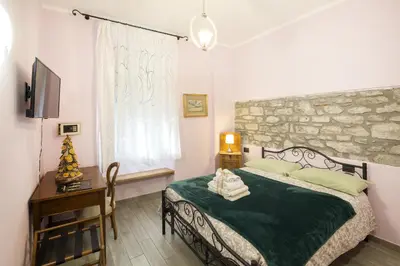 Letto o letti in una camera di Alla Porta Di Sotto B&B
