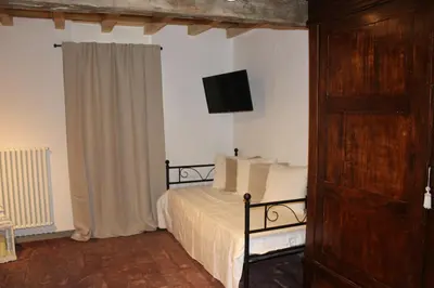 Letto o letti in una camera di AGRITURISMO LE ZORLESCHE