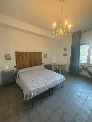 Letto o letti in una camera di AGRITURISMO LE ZORLESCHE