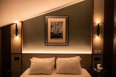 Letto o letti in una camera di Hotel Duomo Cremona