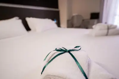 Letto o letti in una camera di Hotel Duomo Cremona