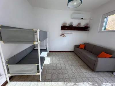 Area soggiorno di Terrace & Parking - Holiday Home near Fegina Beach