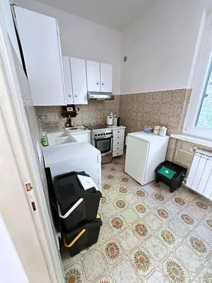 Cucina o angolo cottura di Terrace & Parking - Holiday Home near Fegina Beach