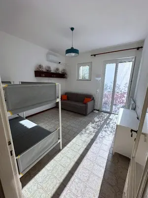 Letto o letti in una camera di Terrace & Parking - Holiday Home near Fegina Beach