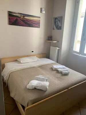 Letto o letti in una camera di La finestra sul Duomo di Pavia