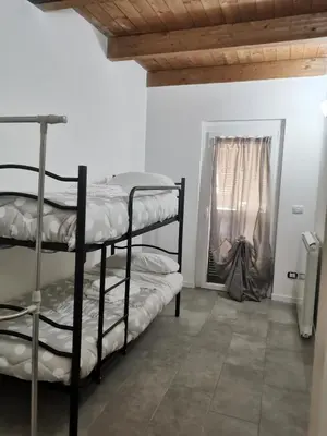 Letto o letti in una camera di Casa GINEVRA
