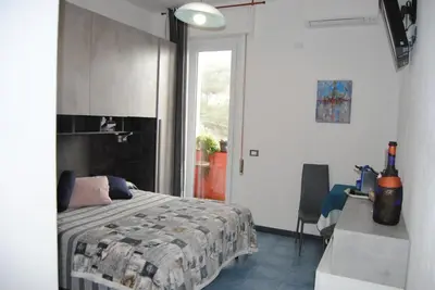 Letto o letti in una camera di Villa Caribe affittacamere