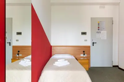 Letto o letti in una camera di UniHo Hostel