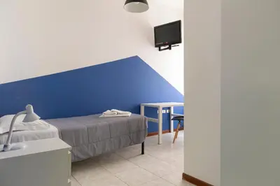 Letto o letti in una camera di UniHo Hostel