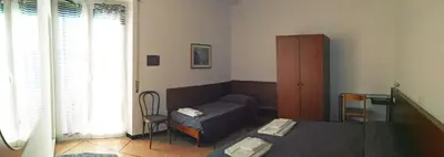 Letto o letti in una camera di Hotel Suisse