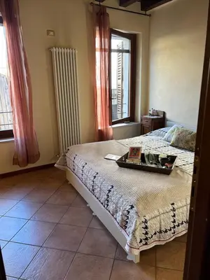 Letto o letti in una camera di Residenza dei Mille