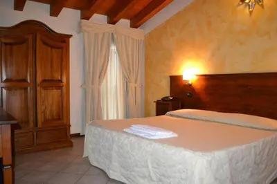 Letto o letti in una camera di Albergo La Piana