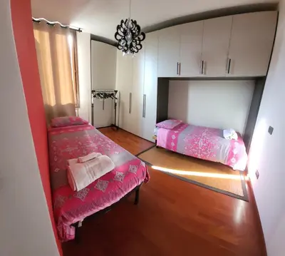 Letto o letti in una camera di Casa Cristina