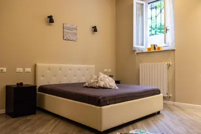 Letto o letti in una camera di Bilocale vicino Stazione CIR 00015