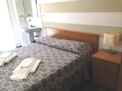 Letto o letti in una camera di Albergo La Neigra