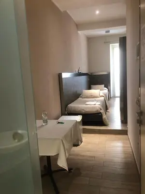 Letto o letti in una camera di Residenza Solferino