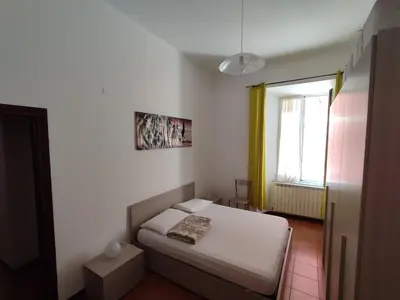 Letto o letti in una camera di Cozy flat cinque terre Moneglia