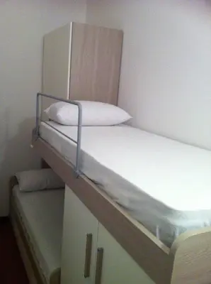 Letto o letti in una camera di Cozy flat cinque terre Moneglia
