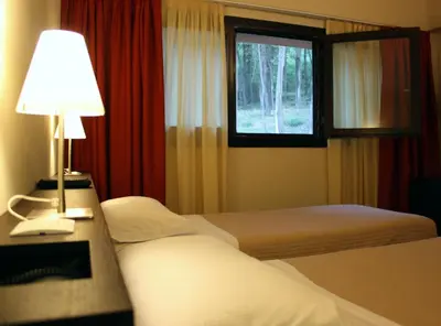 Letto o letti in una camera di Hotel Bersè